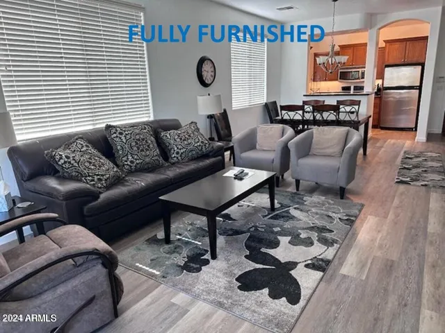 Living room with view of kitchen and dining. FULLY FURNISHED RENTAL