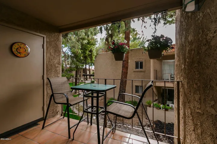Covered Patio over looking complex, also features storage room access.