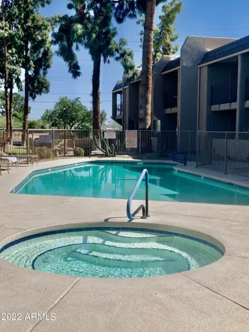 Closest heated pool and hottub to condo with lots of seating for sun bathing