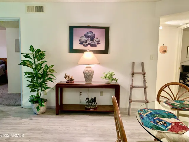 Area between bedrooms, utility closet and bathroom with tub/shower