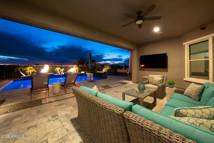 Patio with mechanical drop down screen turning it into an Arizona room