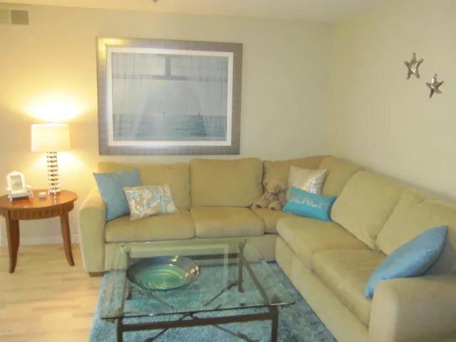 Sectional with inviting "beach" artwork to set the mood!