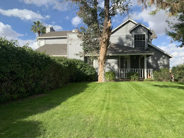 The lush front yard is perfect for games and is a cooling touch.