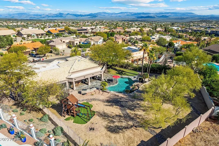 Aerial view of property and mountains