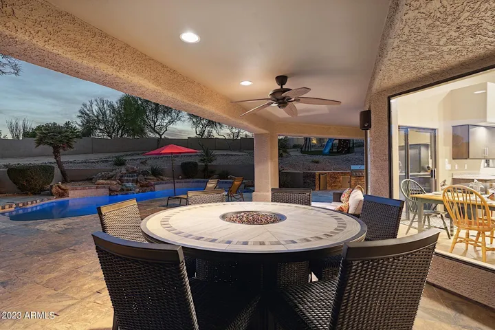 Twilight photo of the fire pit dining table.