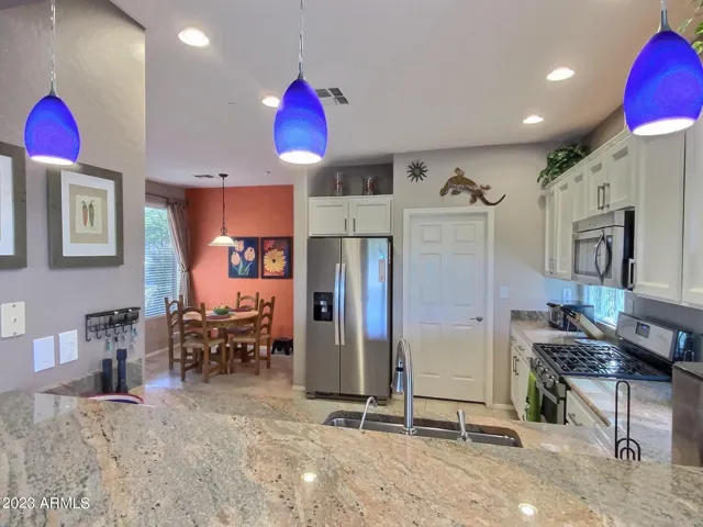 Kitchen with Granite Counters and Breakfast Bar