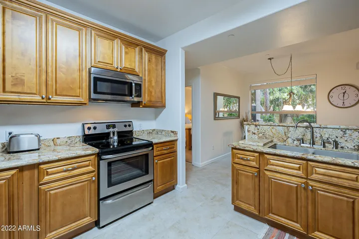 Granite, Newer Cabinets + SS appliances