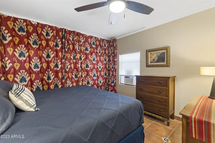 Primary bedroom with king bed, and blackout shades