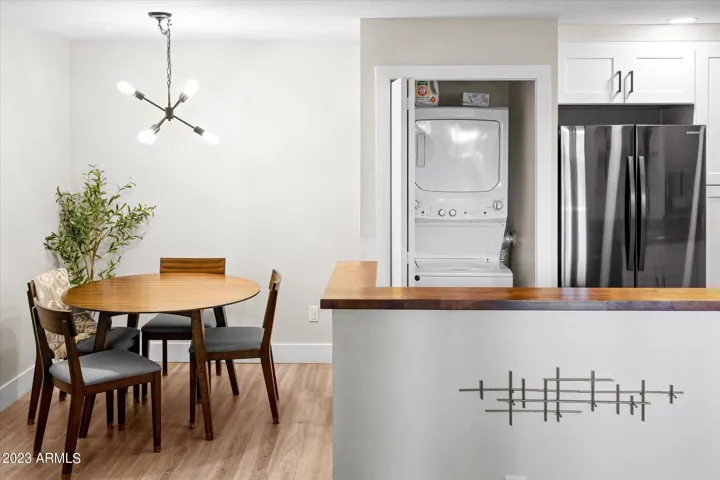 You'll find washer, dryer, and supplies tucked away in the laundry closet off the kitchen.
