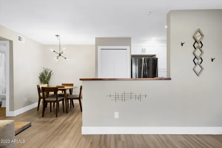 You'll find washer, dryer, and supplies tucked away in the laundry closet off the kitchen.