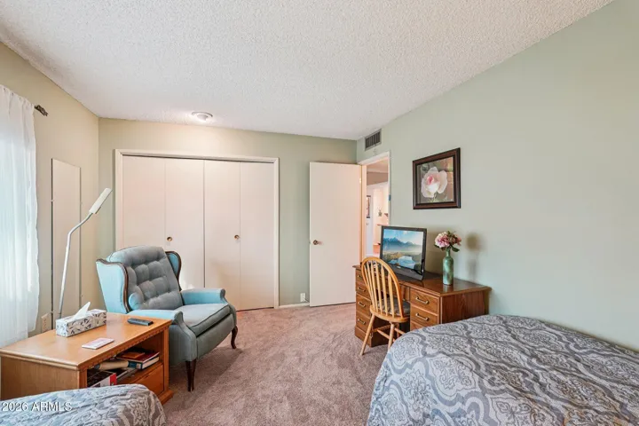2nd bedroom with twin beds, desk & chair