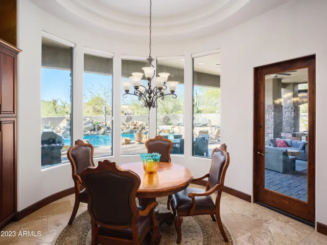 Stunning gourmet-style kitchen with stainless steel appliances, large island, breakfast table, and is fully equipped with your basic cooking essentials.