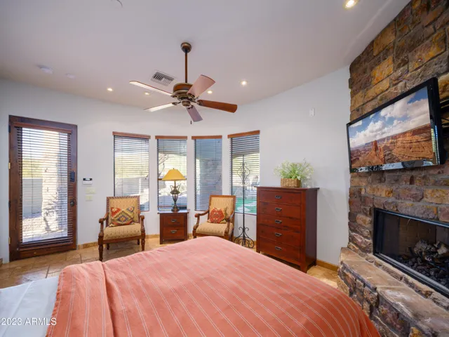 4th bedroom (inside guest casita): Features a King bed, fireplace, en-suite bathroom, and sauna!