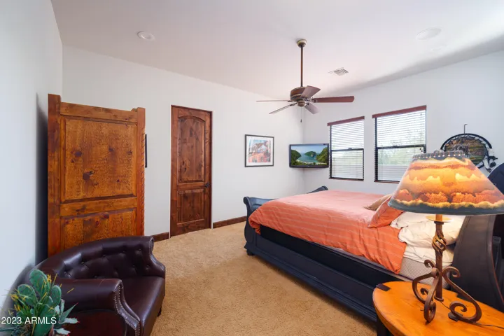 3rd bedroom with Queen bed, smart TV, and en-suite bathroom.