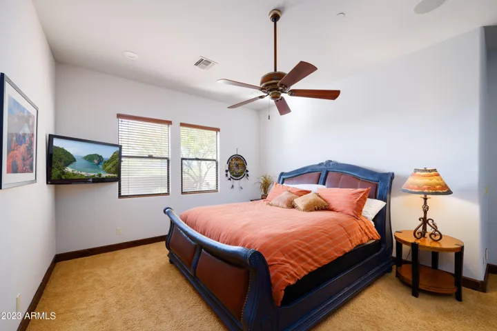 3rd bedroom with Queen bed, smart TV, and en-suite bathroom.