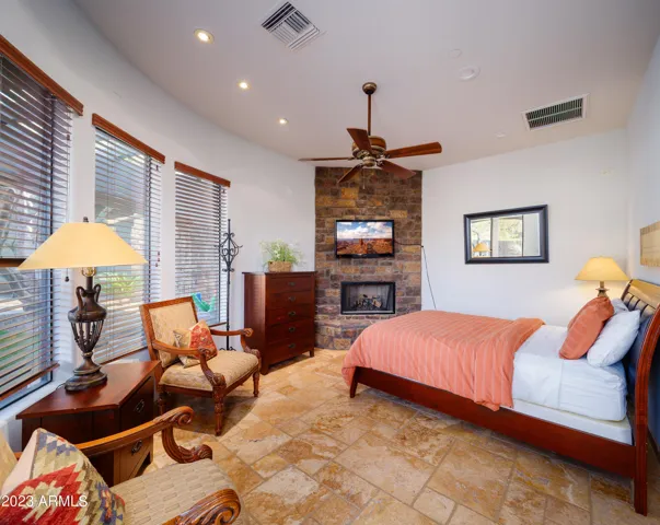 4th bedroom (inside guest casita): Features a King bed, fireplace, en-suite bathroom, and sauna!