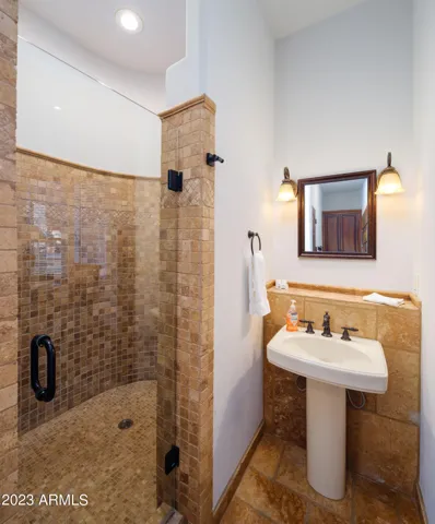 4th bedroom (inside guest casita): Features a King bed, fireplace, en-suite bathroom, and sauna!