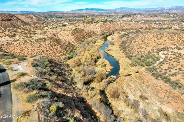 Located on a Cal-de-sac this property is hilltop and then all the way down to the Oak Creek.