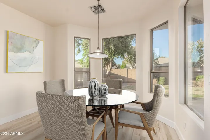 Eat in kitchen area staged.