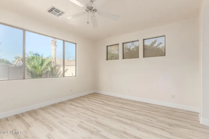 Primary bedroom looking out to back yard.