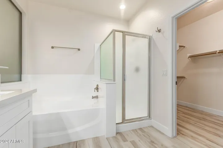 Primary bath with separate tub and shower.