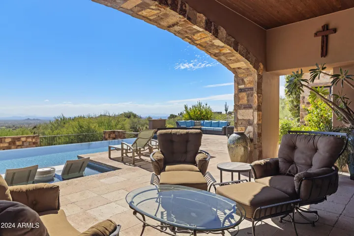 South facing Heated Negative Edge Pool w/Fire Feature, Spa, Splash Pad, Bocci Ball, Dual Patios, Automatic Lights, Mister Systems, Sound System and so much more!!!