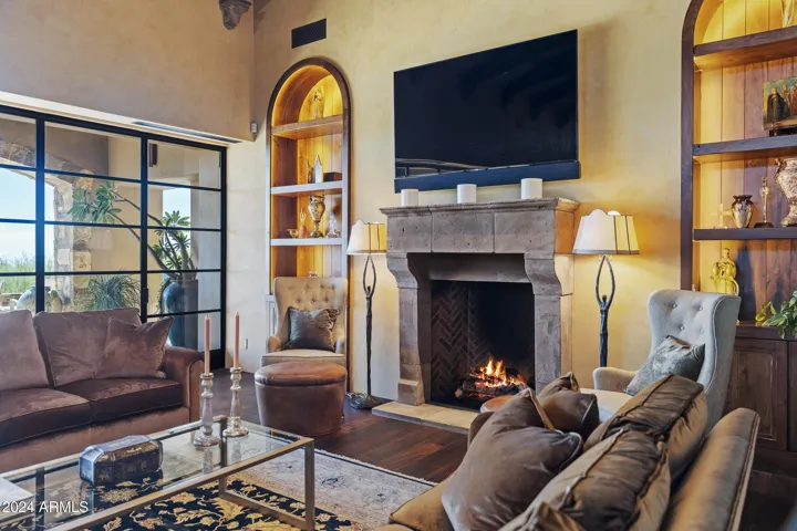 Grand Living Room with Fireplace and Floor to Ceiling Collapsible Patio Doors