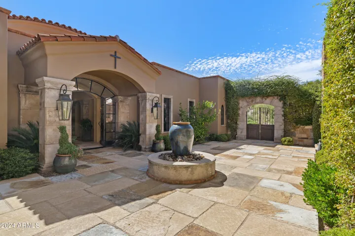 Italian Courtyard with Fountain, Gas Fire Coach Lights, mature landscaping, tranquil gated entry.