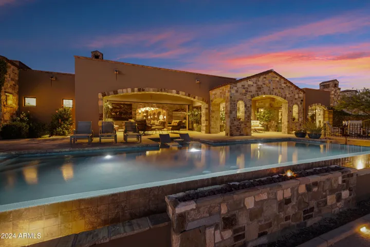 South Facing Heated Negative Edge Pool w/Fire Feature, Spa, Splash Pad, Bocci Ball, Dual Patios, Automatic Lights, Mister Systems, Sound System and so much more!!!