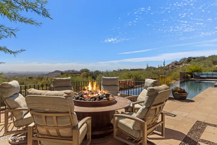South facing Heated Negative Edge Pool w/Fire Feature, Spa, Splash Pad, Bocci Ball, Dual Patios, Automatic Lights, Mister Systems, Sound System and so much more!!!