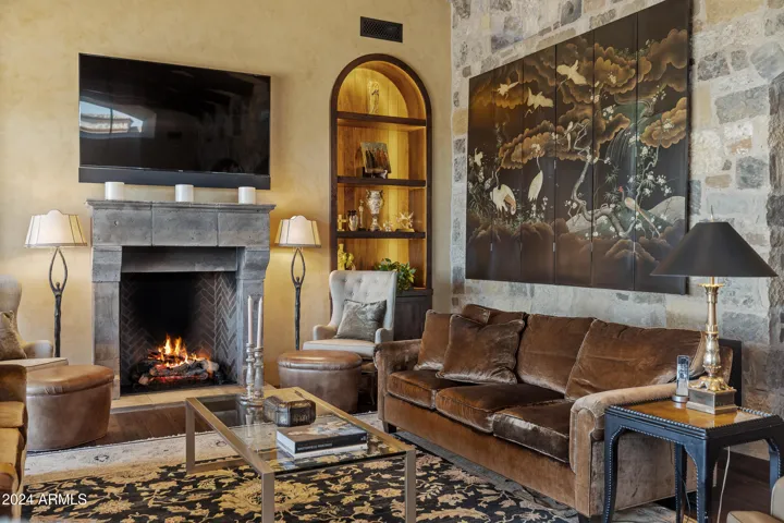 Grand Living Room with Fireplace and Floor to Ceiling Collapsible Patio Doors