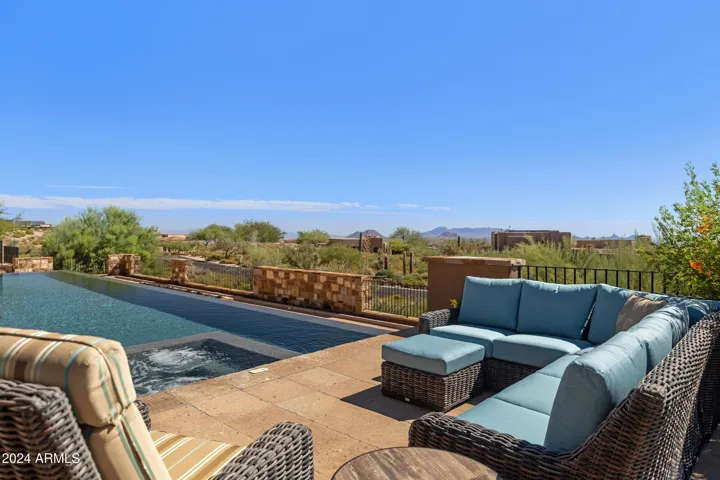 South facing Heated Negative Edge Pool w/Fire Feature, Spa, Splash Pad, Bocci Ball, Dual Patios, Automatic Lights, Mister Systems, Sound System and so much more!!!