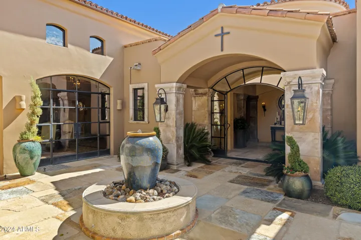 Italian Courtyard with Fountain, Gas Fire Coach Lights, mature landscaping, tranquil gated entry.