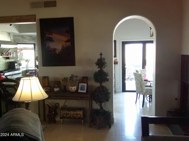 Access to eat-in-kitchen with sliding accordian door to backyard