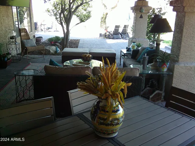 Covered patio has seating for 24