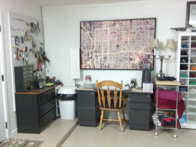 In the three-car garage there is a separate storage area as well as a tookl organization area and handman desk