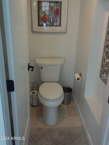 The primary bathroom has a private water closet. There is a large wlak-in closet designated for "her" and a smaller walk-in closet dedicated for "him".