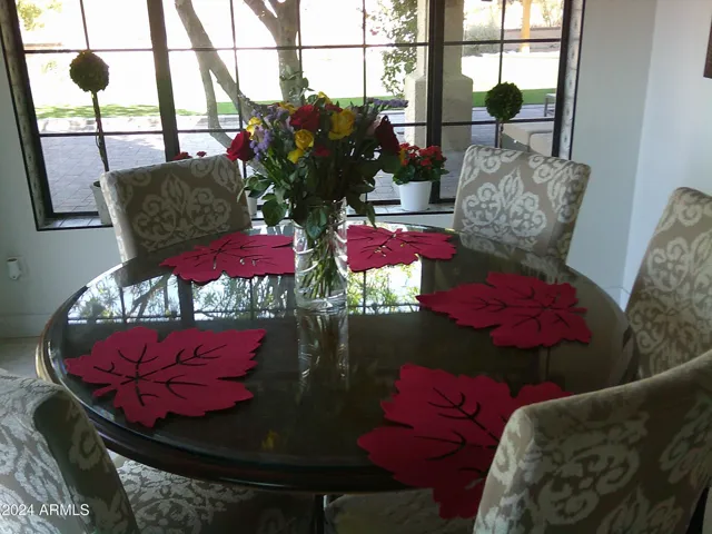 Eat-In-kitchen adjacent to accordian door opening to the backyard