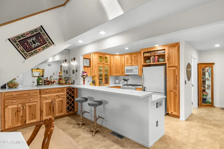 KITCHEN WALL REMOVED TO OPEN THE SPACE TO DINING ROOM