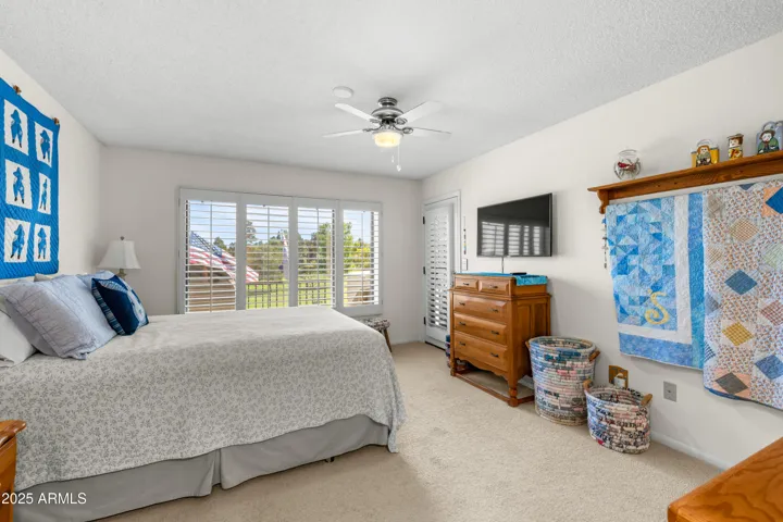 ACCESS TO THE DECK FROM THE SPACIOUS PRIMARY BEDROOM