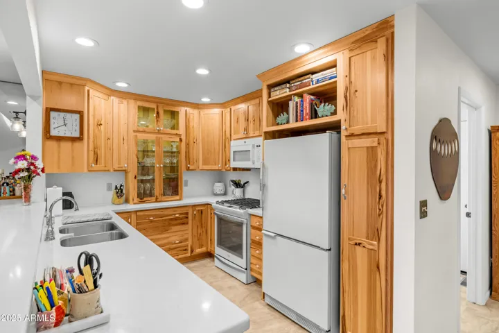 CUSTOM HICKORY CABINETRY WITH UNDER COUNTER AND INTERIOR LIGHTING