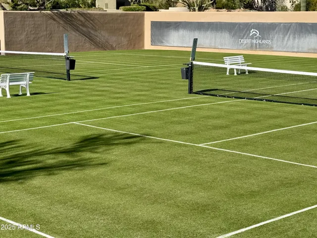 Meticulously maintained grass tennis courts are located within an easy 100-yard walk from the home at Desert Highlands #300