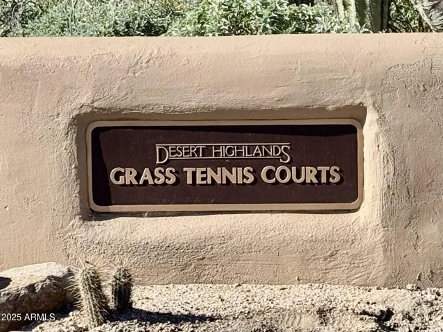 Meticulously maintained grass tennis courts are located within an easy 100-yard walk from the home at Desert Highlands #300