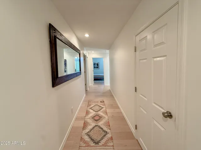 Hallway between 3 downstairs bedrooms and 2 full baths