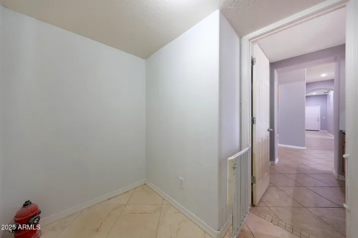 this room off the family room, has a built in gate for small animals and an entry out for dog/cat door