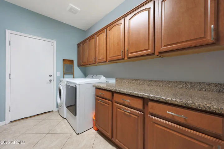 ample cabinet space for your laundry and other needs