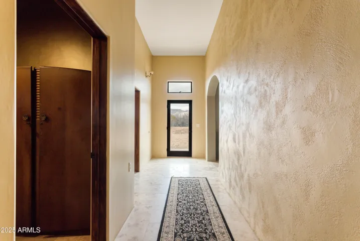 Hallway, beautiful hand troweled walls.