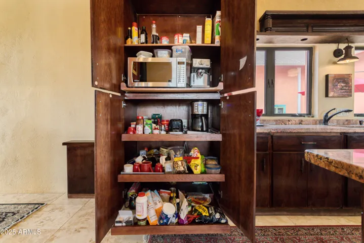 Hidden coffee station, toaster and microwave.
