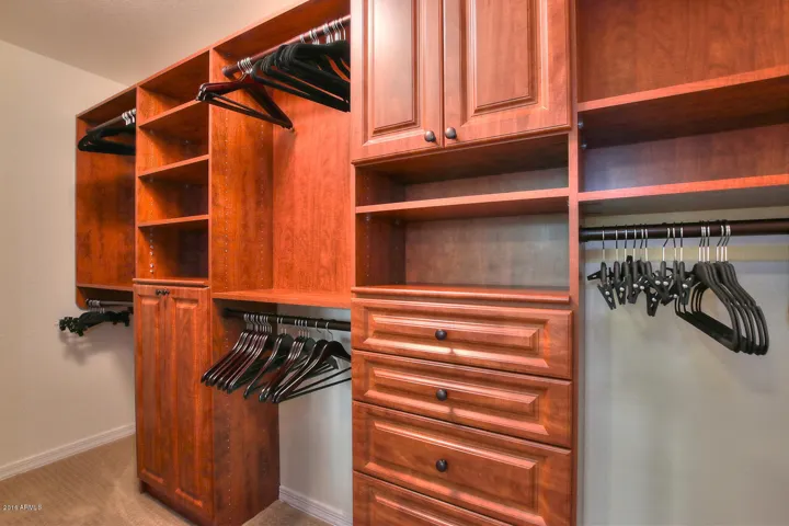 Primary walk-in closet w/custom built-ins