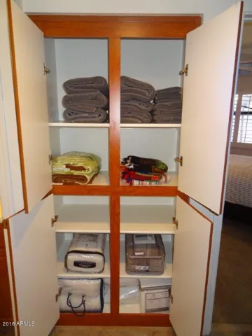 Towels, pool towels, extra blankets and bedding for queen size couch pull-out in hall linen closet